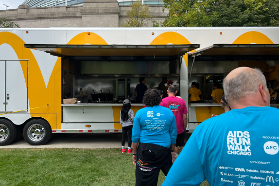 A line of individuals in front of the McRig – a mobile McDonald’s restaurant – at the AIDS Run & Walk in Chicago